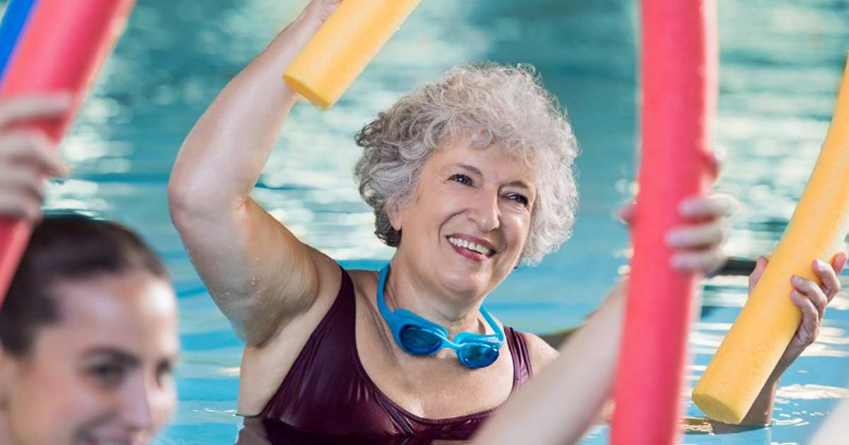 Senior woman doing aquatic aerobics