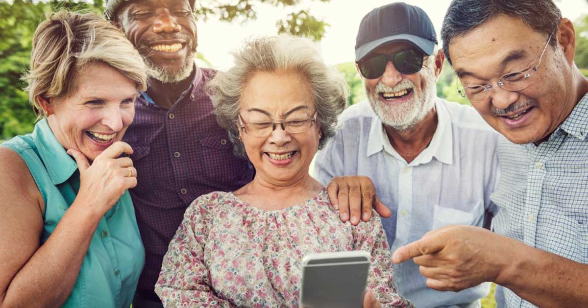 group of seniors using a smartphone