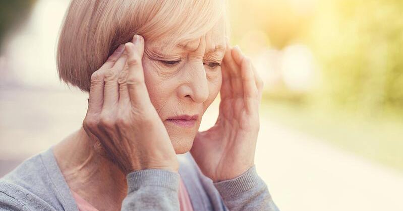 Senior woman with a headache
