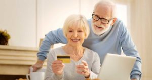 Senior couple making an online purchase