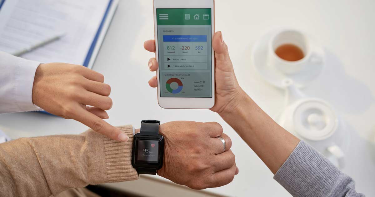 Senior with smart watch and smartphone