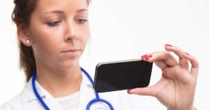 Nurse looking at her smartphone